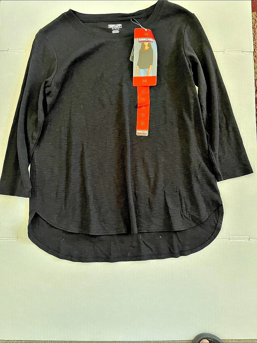 Long Sleeve Curved Hem Top in Black Size Medium